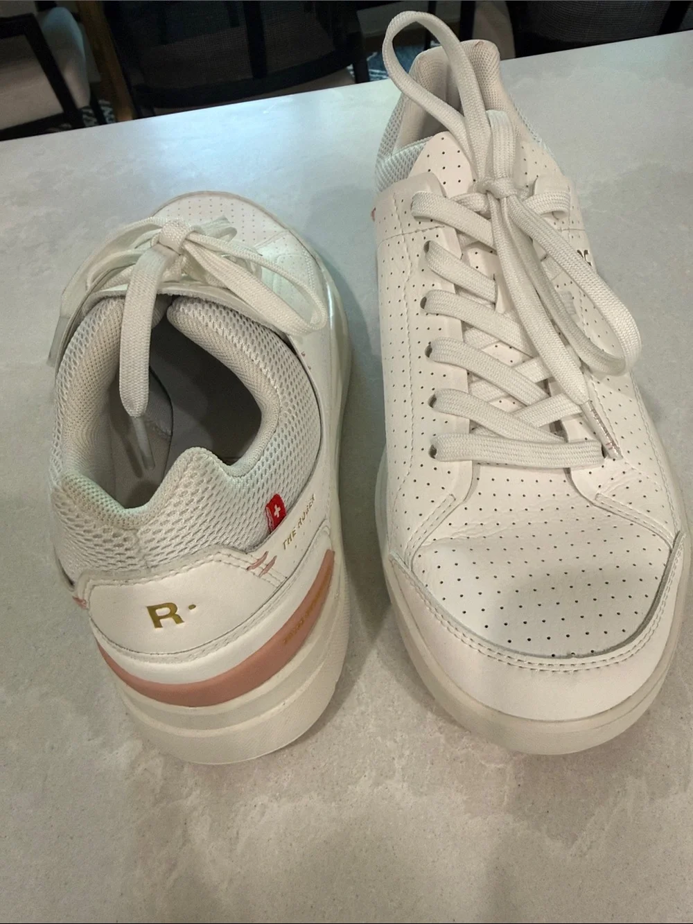 On Cloud . The Roger  Women's Perforated Leather Sneakers